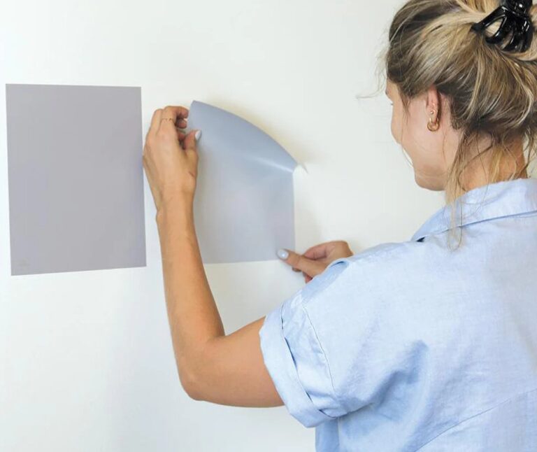 woman picking out a paint colour